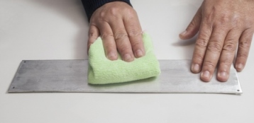 Wipe surface with a lint-free cloth